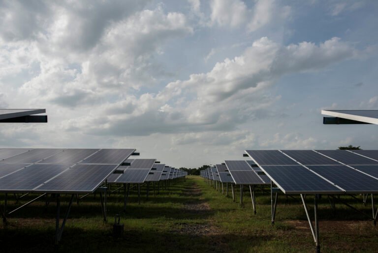 Solar panel farm under cloudy sky — addressing the myth about solar efficiency on cloudy days